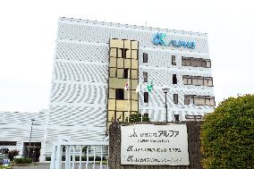 Alpha exterior, logo and signage